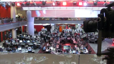 BBC Broadcasting House newsroom with journalists at workstations